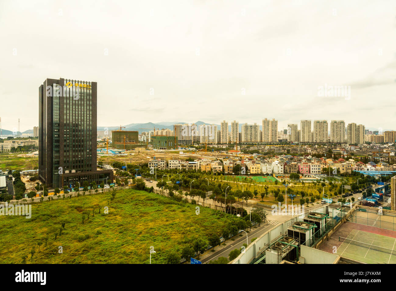 Wenzhou, Zhejiang, China.  Urban Growth.  New High-rise Buildings Replace Old Residences. Stock Photo