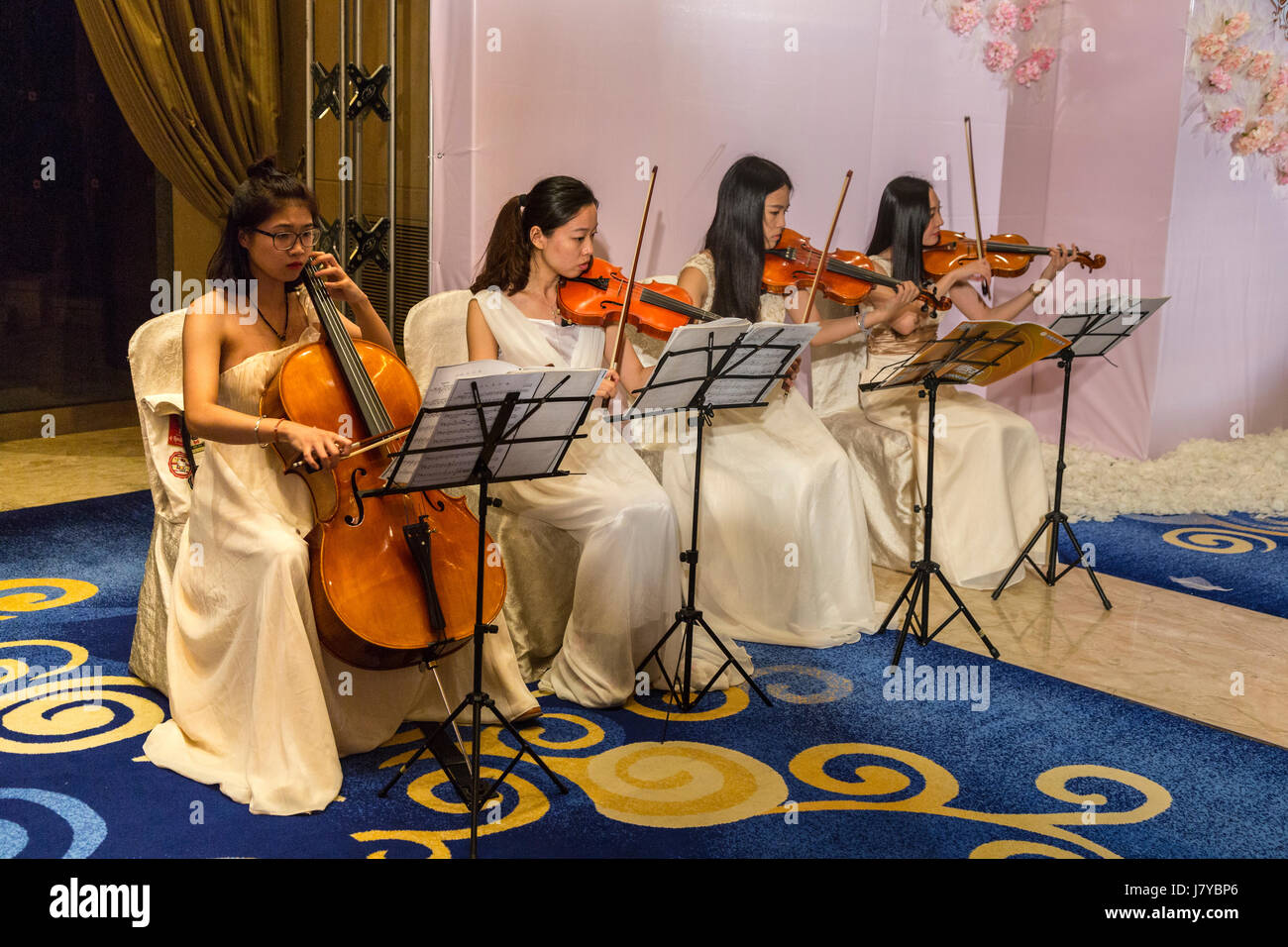 Wenzhou, Zhejiang, China.  Chinese Women's String Quartet in Performance. Stock Photo