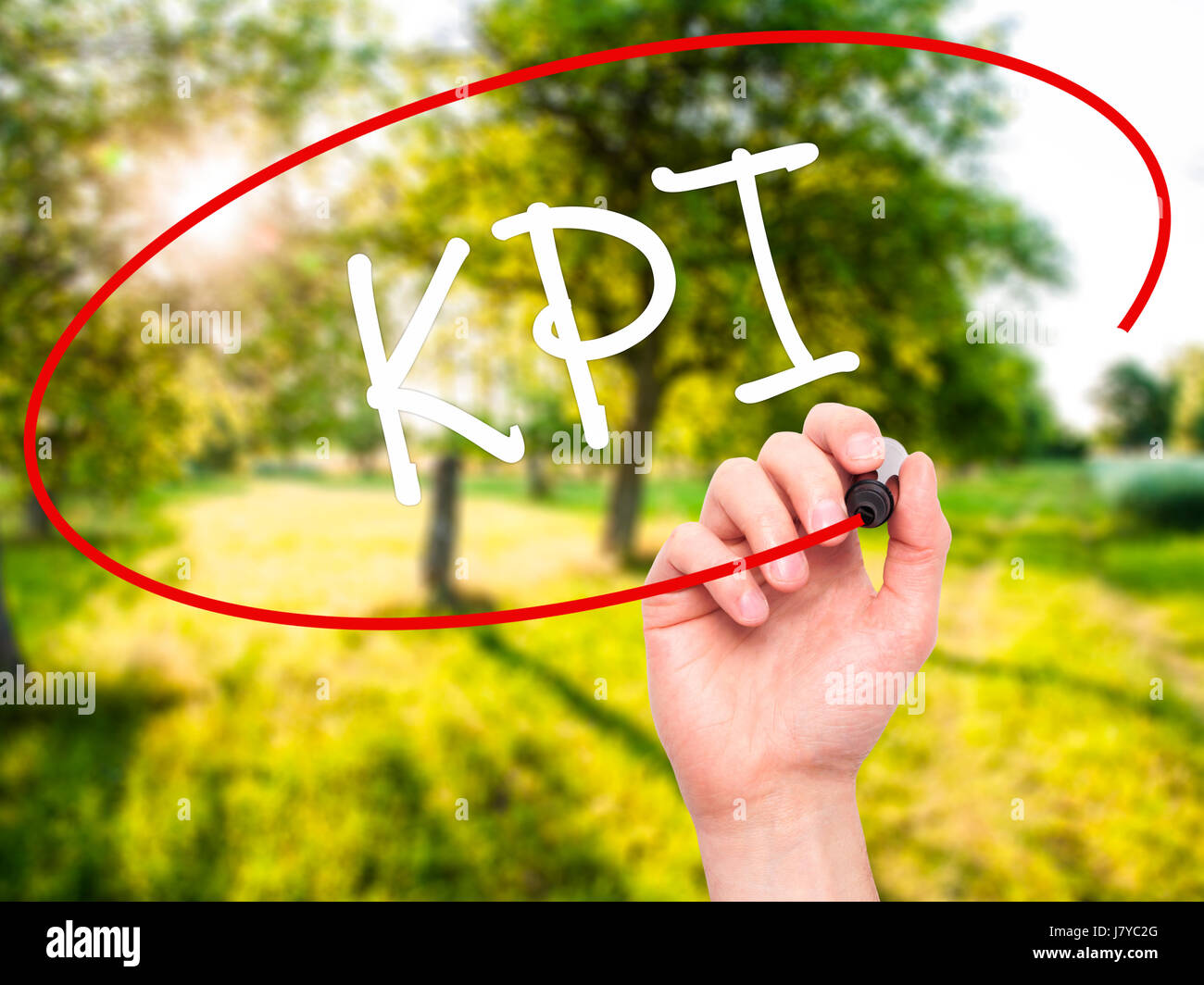 Man Hand writing KPI (Key Performance Indicator) with black marker on ...