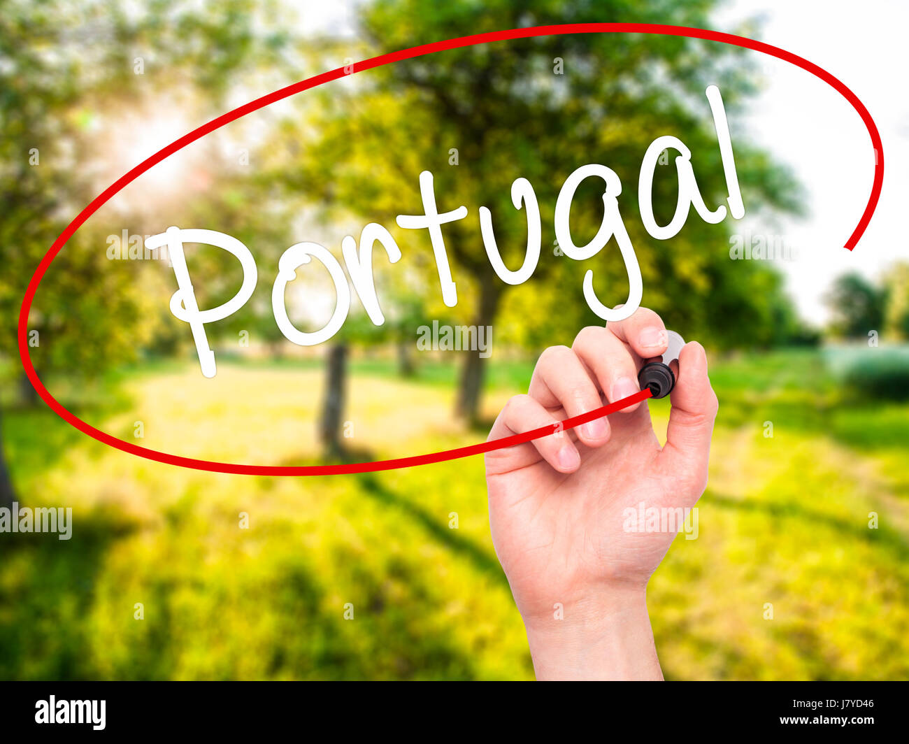 Man Hand writing  Portugal  with black marker on visual screen. Isolated on nature. Business, technology, internet concept. Stock Photo Stock Photo