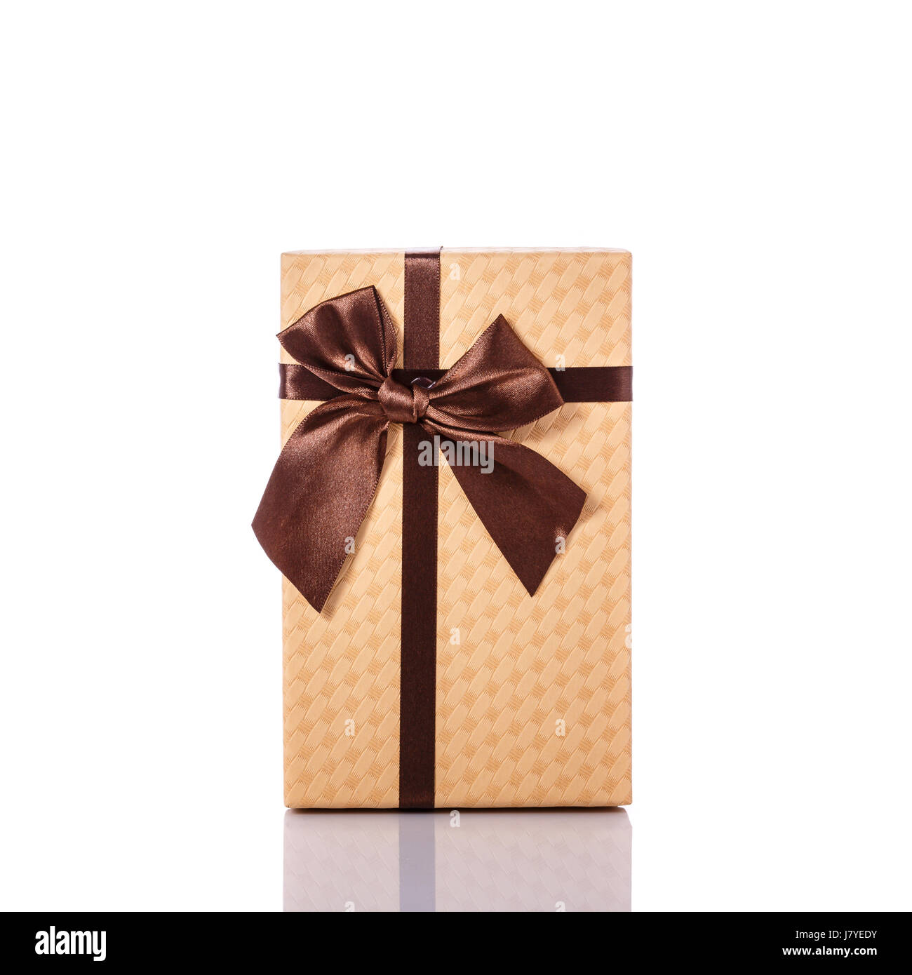 Black gift box wrapped with a red and tan natural raffia bow on a white  background. Horizontal shot. Isolated on white Stock Photo - Alamy