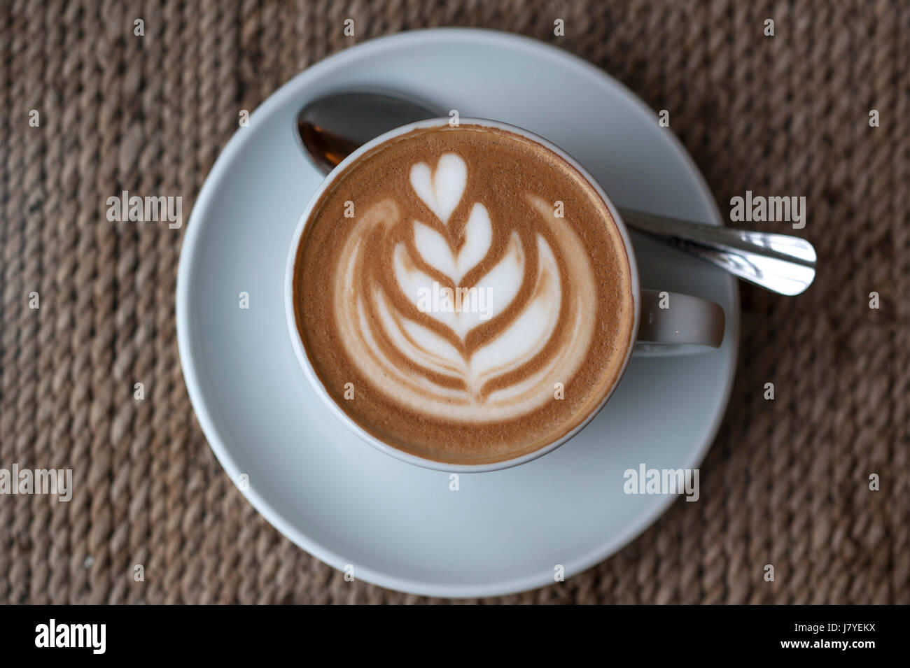 Cappuccino with decorated milk froth Stock Photo