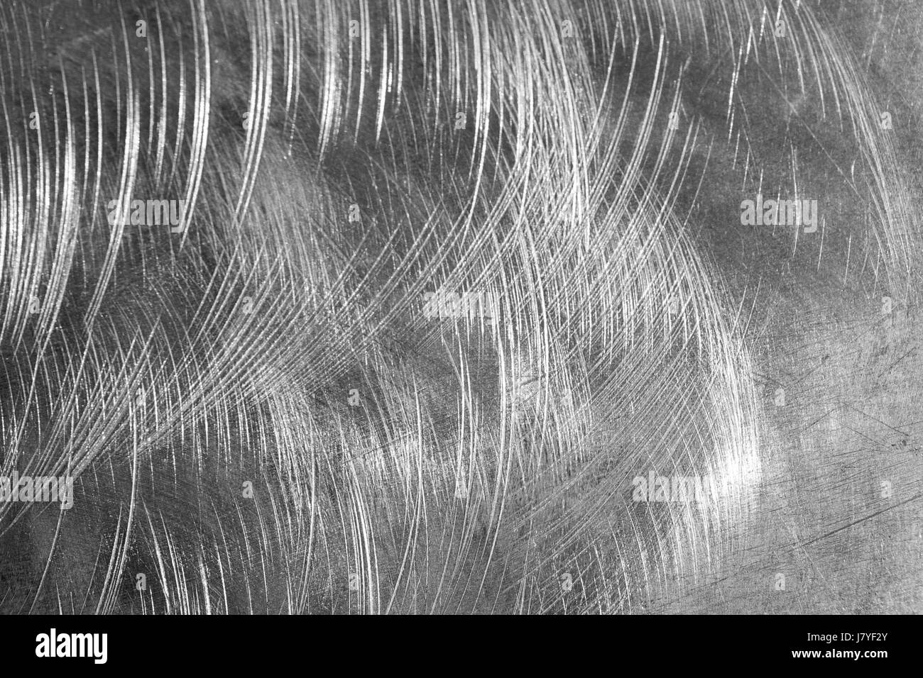 Macro shot of scratched, shiny metallic surface. Stock Photo