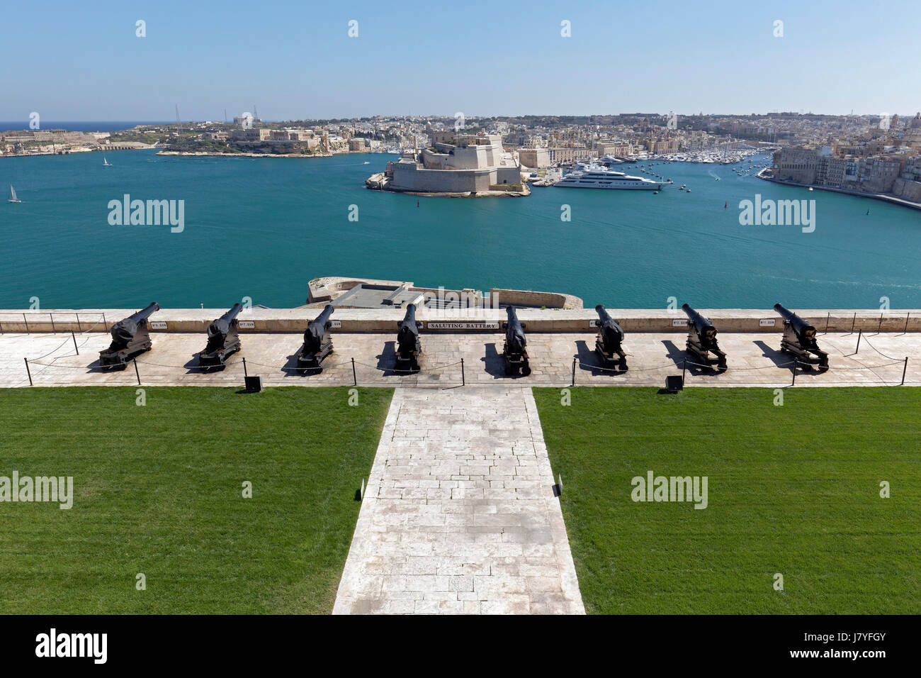 Cannons of the Saluting Battery, view of Three Cities and Grand Harbor, Valletta, Malta Stock Photo