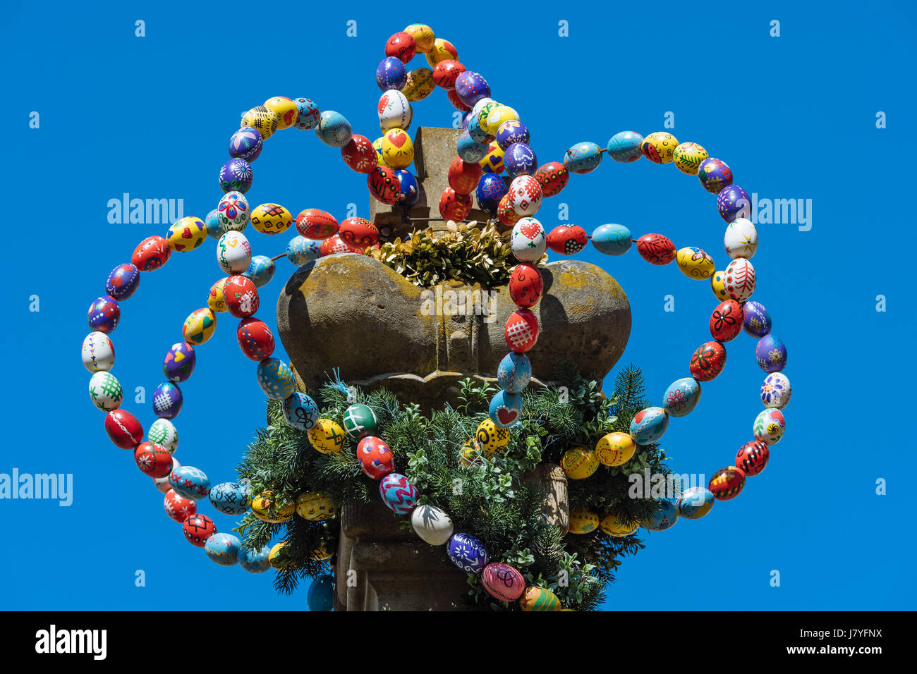 Osterkrone, crown from colorful Easter eggs, Osterbrunnen, Langenburg, Baden-Württemberg, Germany Stock Photo