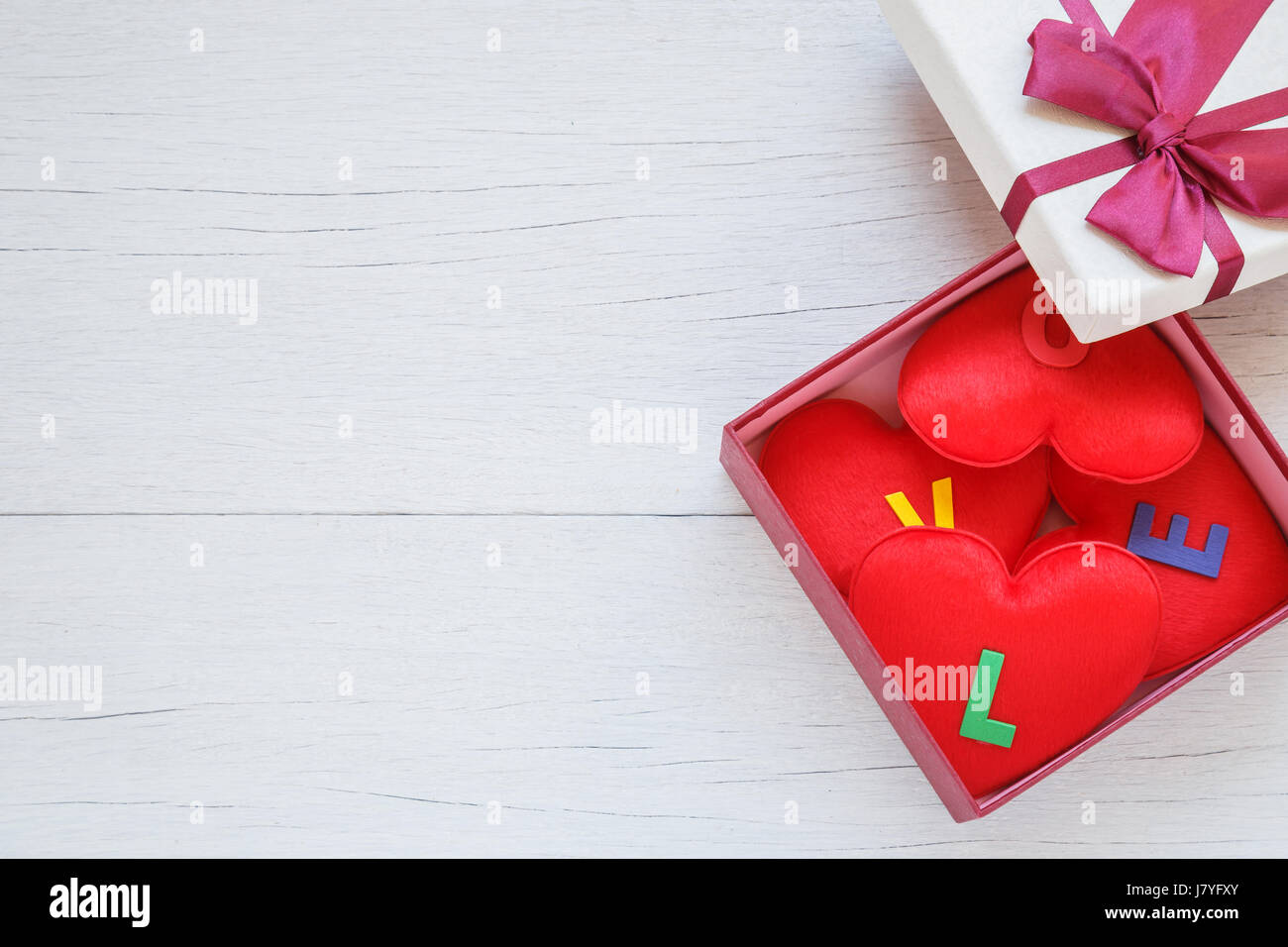 Top View Red Heart Shape With Love Word In Gift Box With Ribbon On White Wooden Plank Background For Love Or Valentine Day Concept Top View Red Heart Shape With Love Word In Gift Box With Ribbon On White Wooden Plank Background For Love Or Valentine Day Concept