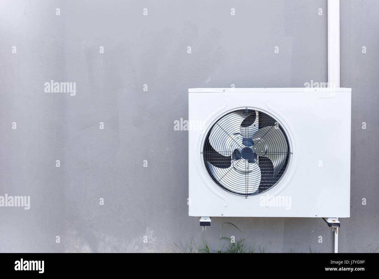 Outdoor air conditioning compressor installed the wall Stock Photo Alamy