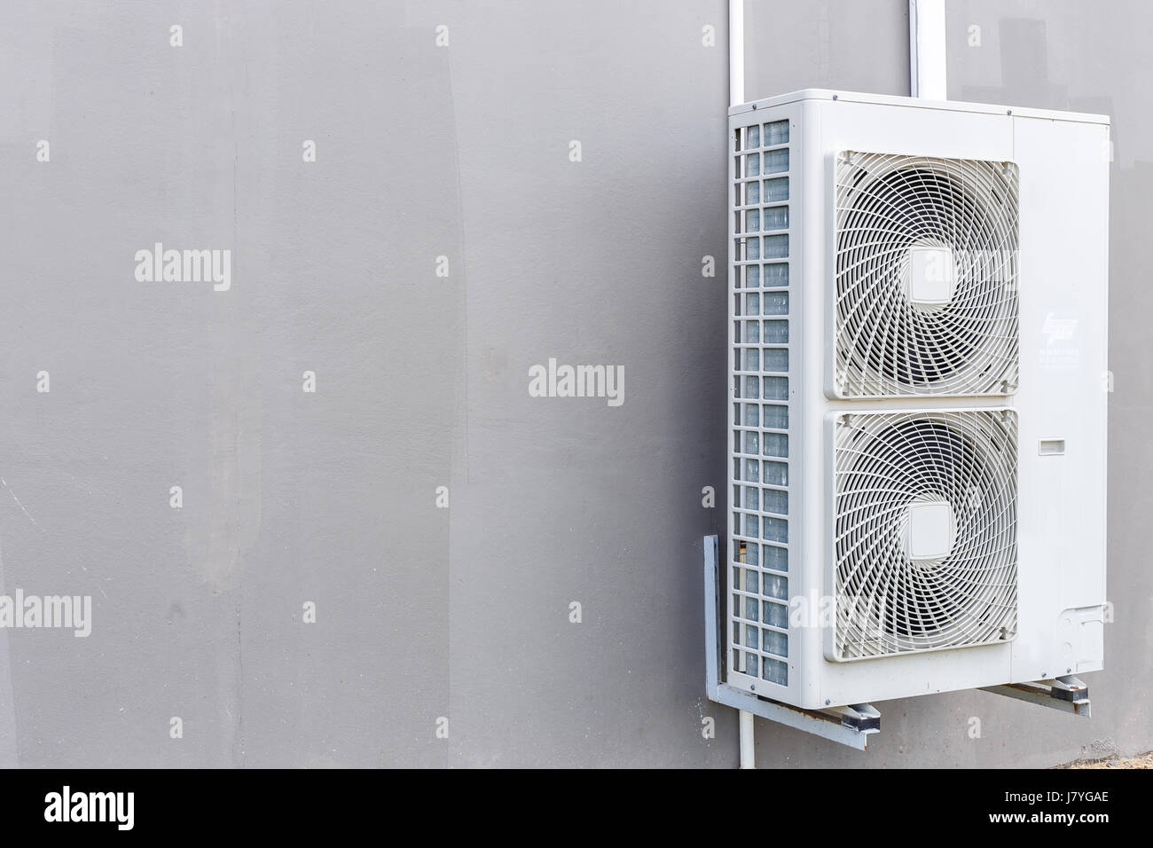 Outdoor air conditioning compressor installed the wall Stock Photo Alamy