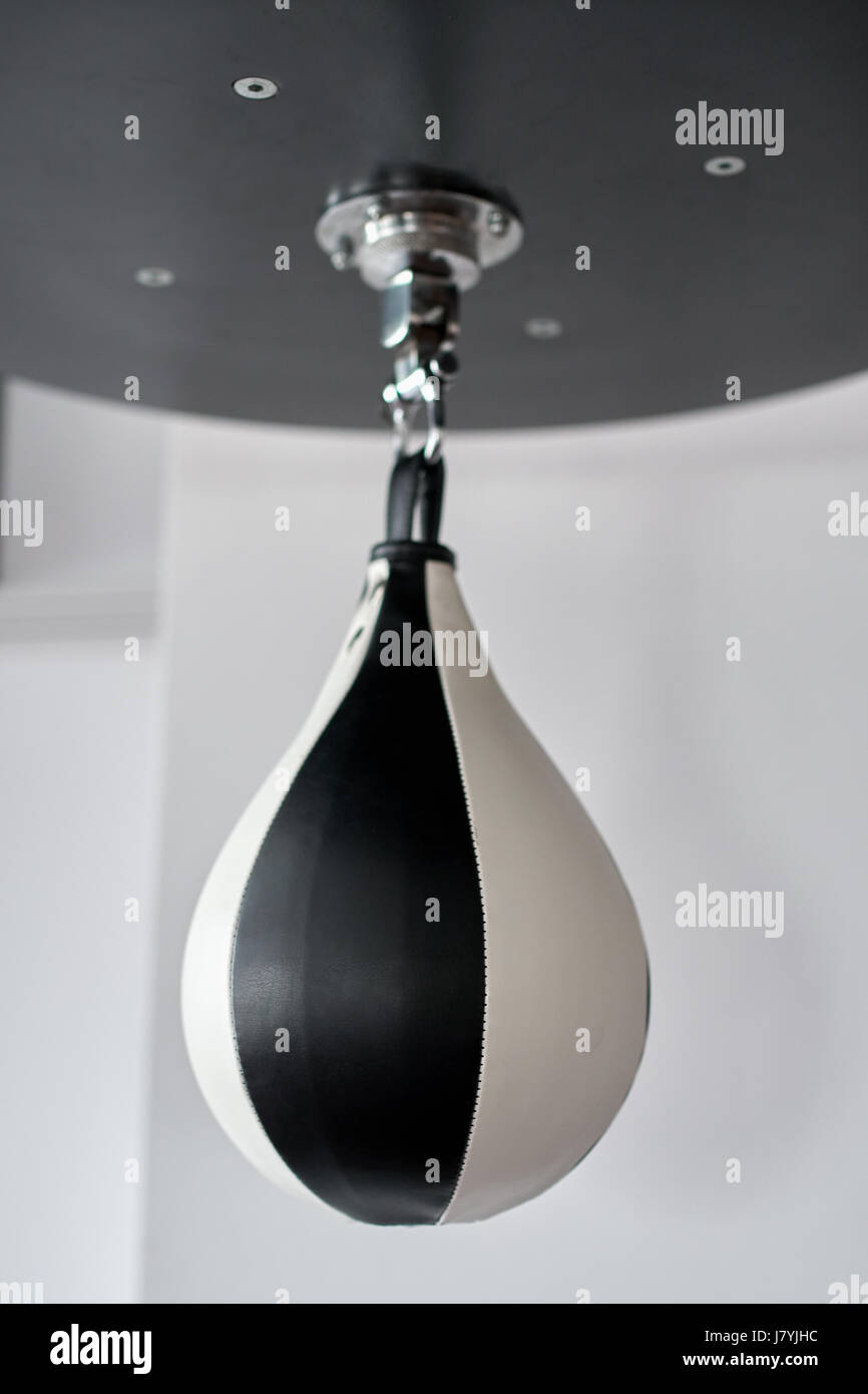 Speed bag for boxing hanging from support Stock Photo - Alamy