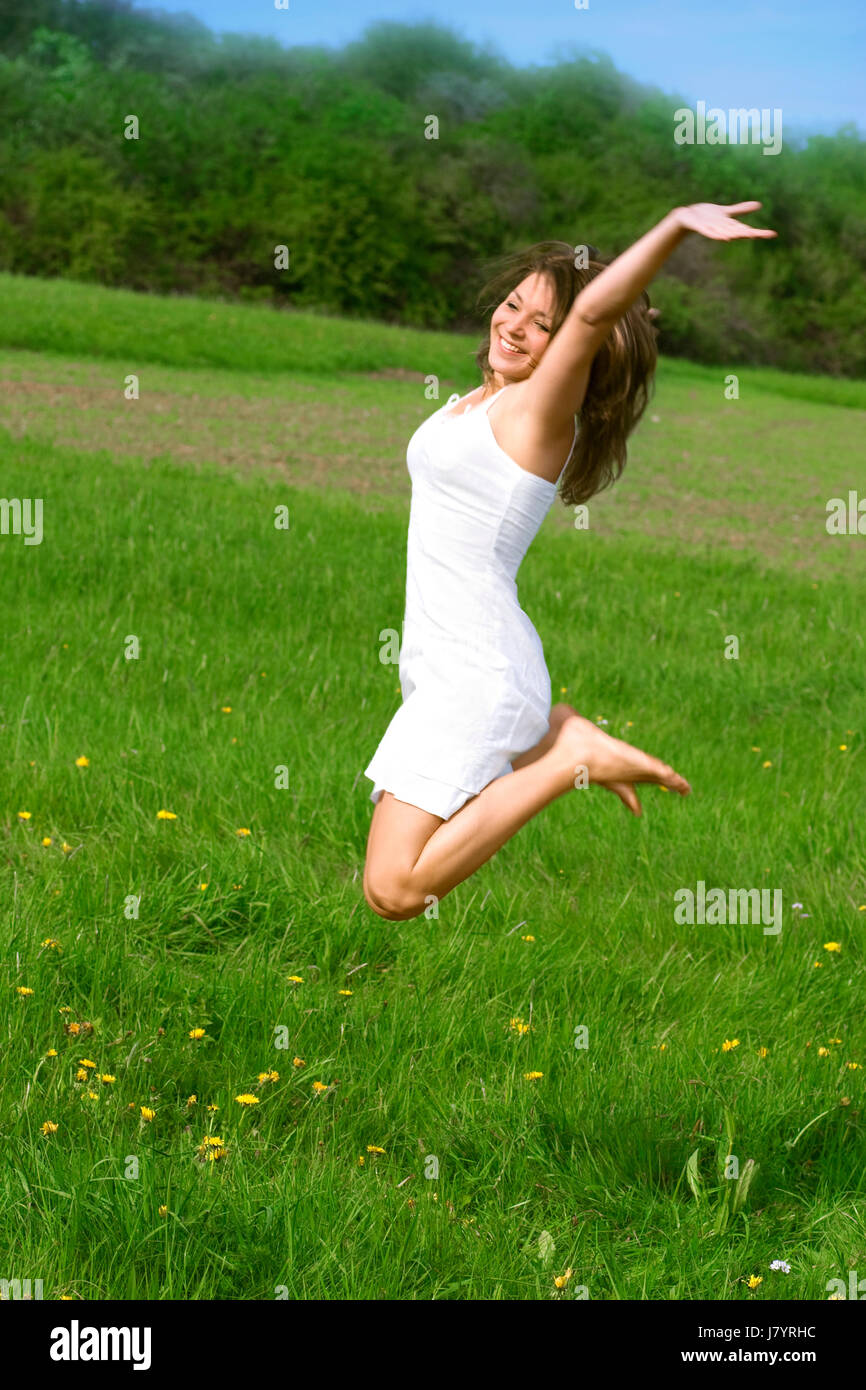 woman women freedom liberty spring bouncing bounces hop skipping frisks jumping Stock Photo