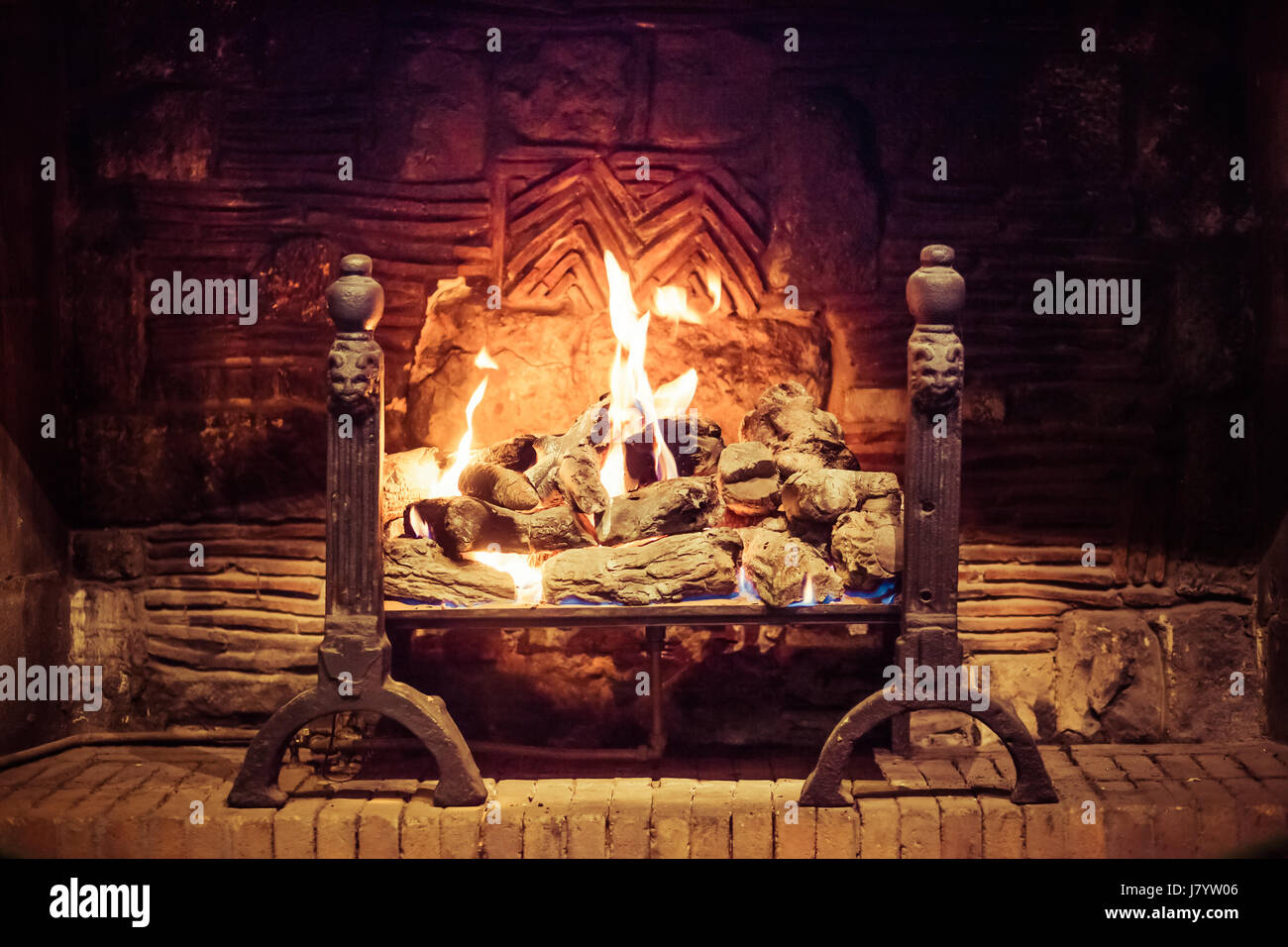 Fire burns in brick fireplace hi-res stock photography and images - Alamy
