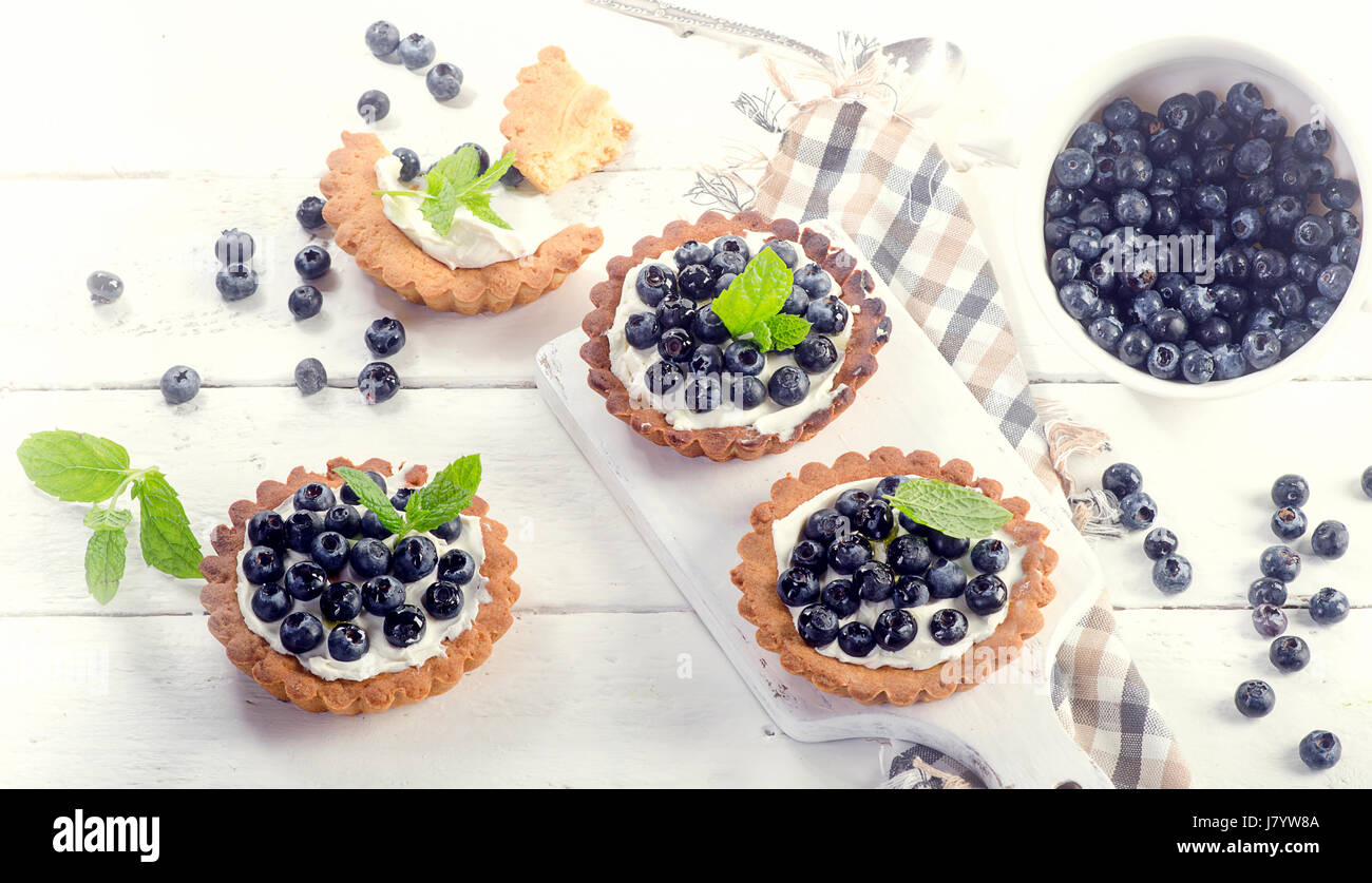Blueberry tarts on a white wooden table. Top view Stock Photo