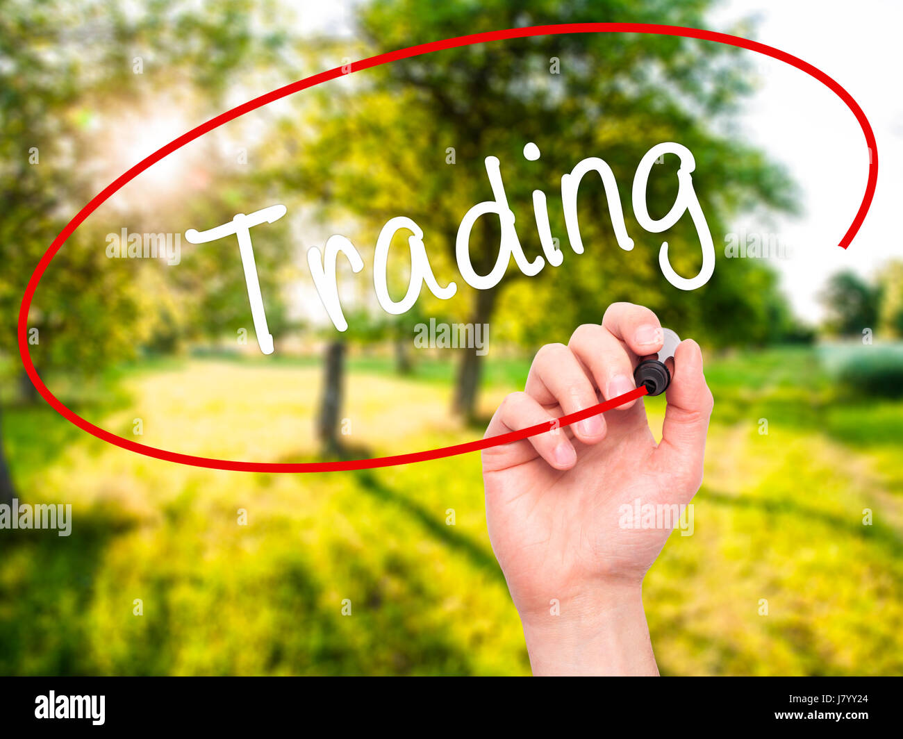Man Hand writing Trading with black marker on visual screen. Isolated ...