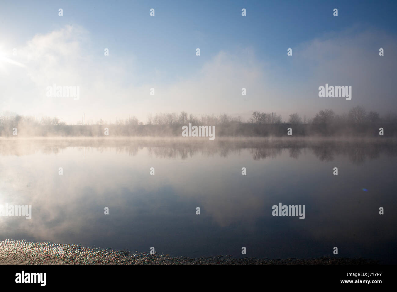 Dense fog on the river in the early morning at dawn with sunrise Stock ...