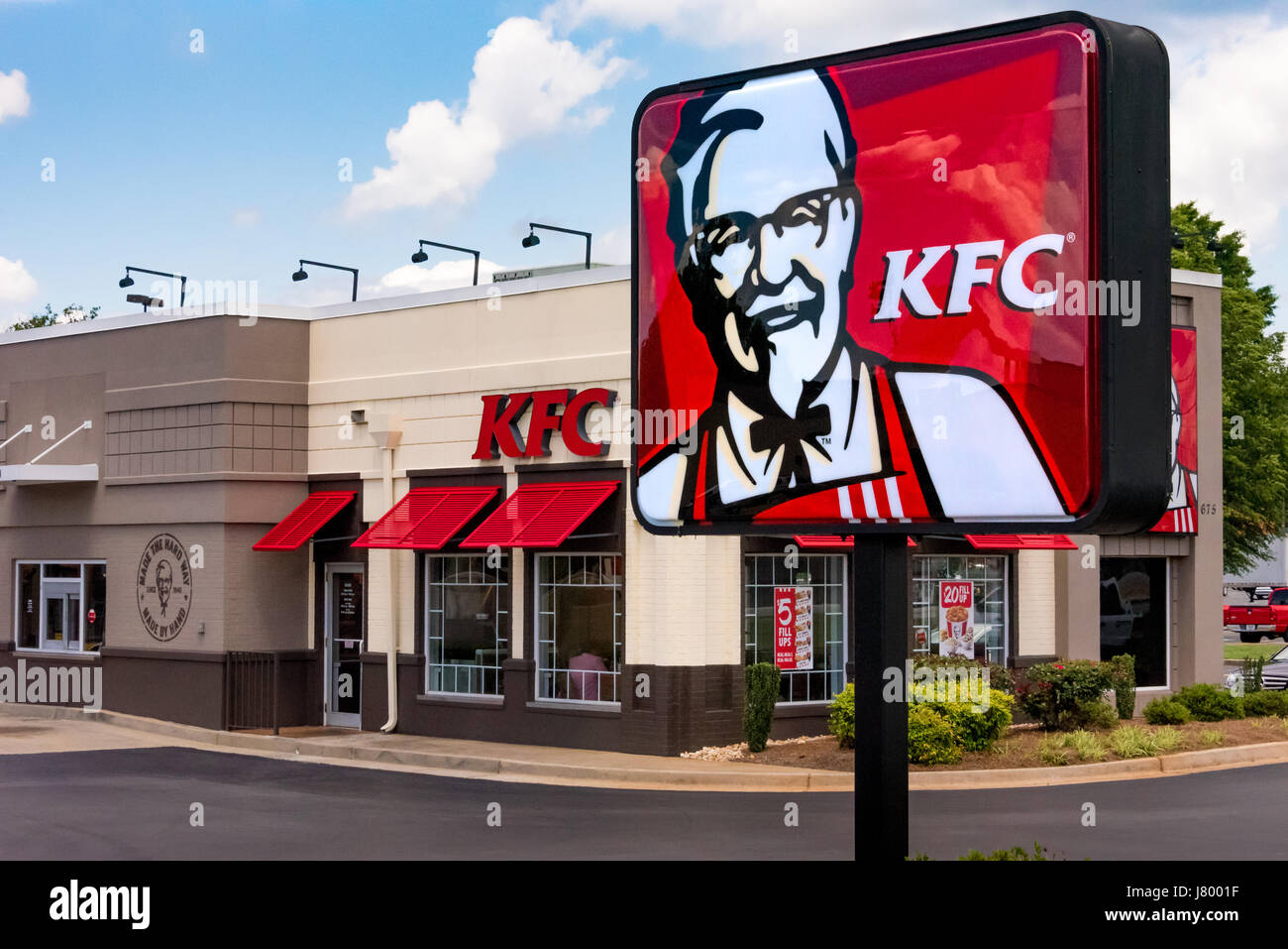 KFC restaurant with sign featuring Colonel Sanders. Stock Photo