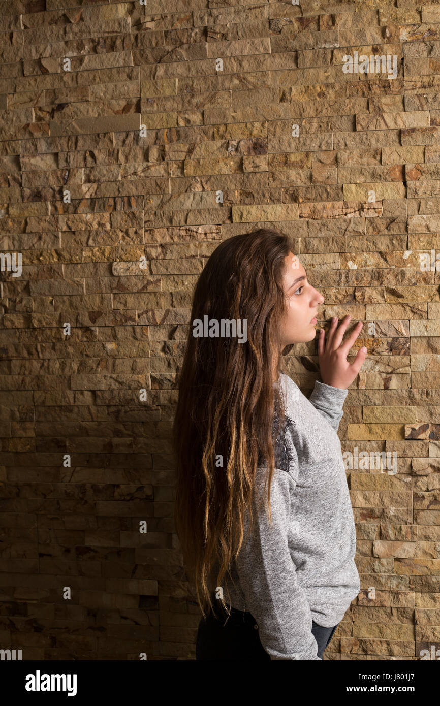 Side view of a teenage girl looking away Stock Photo - Alamy