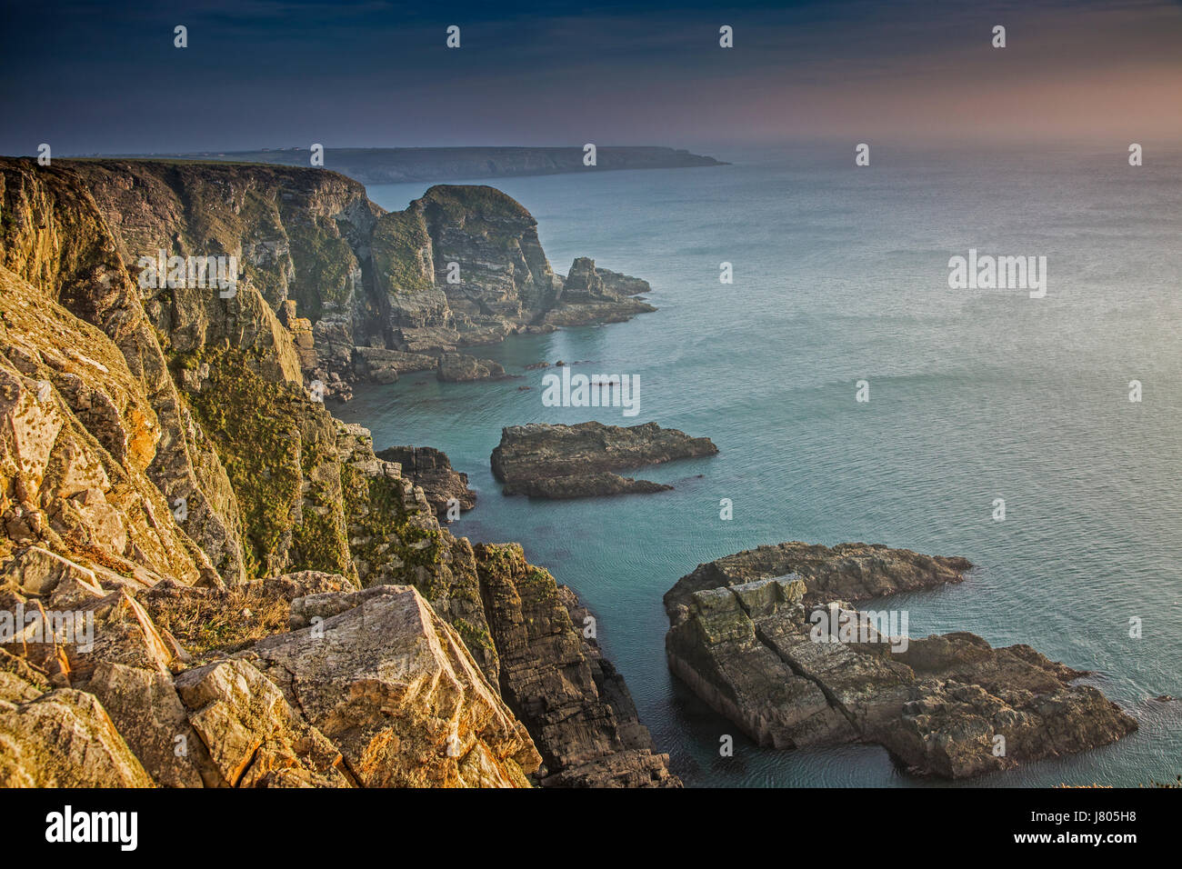 Craggy cliffs overlooking ocean, South Stack cliffs, Anglesey, Wales Stock Photo