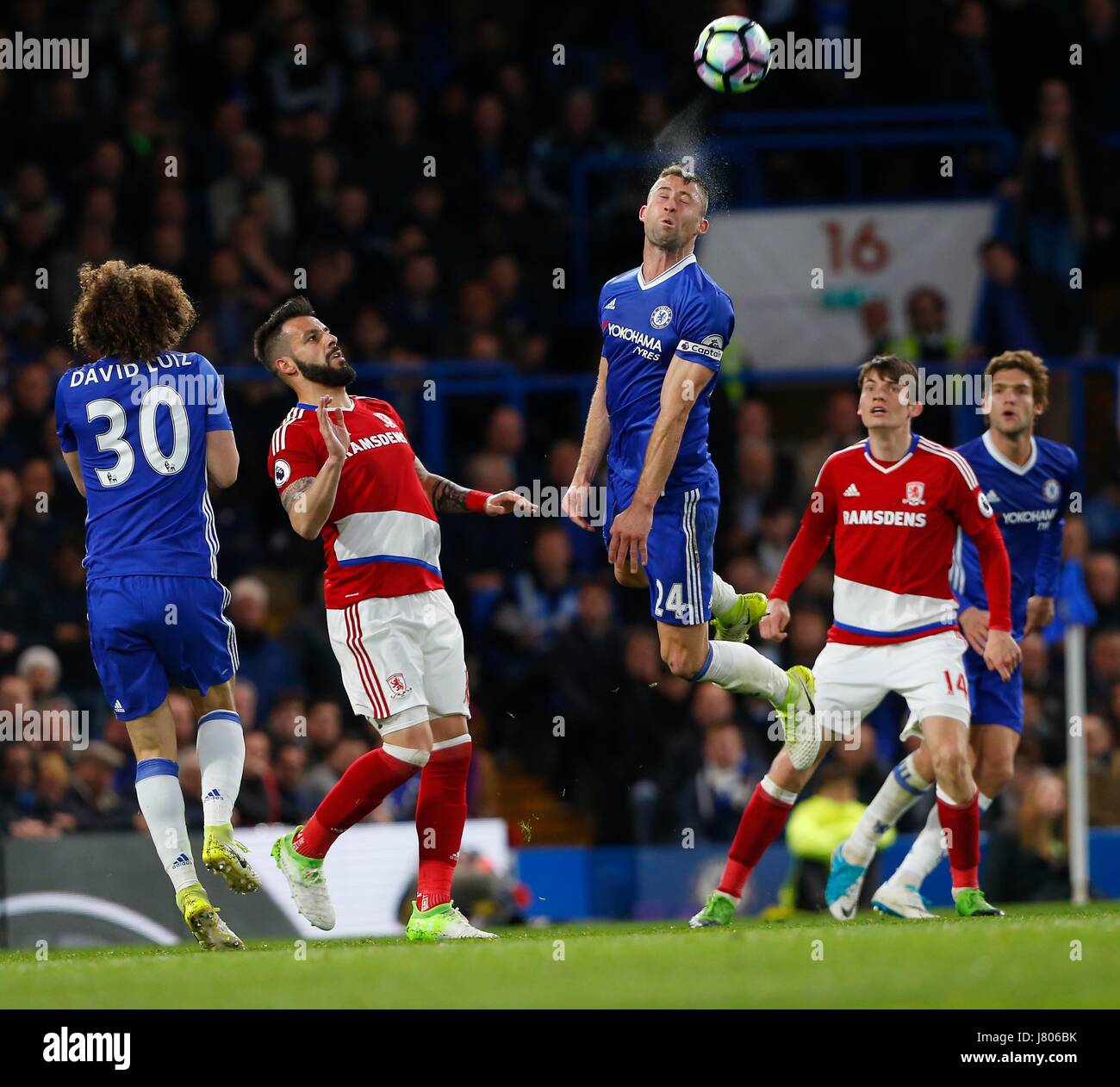Chelsea's Gary Cahill heads the ball during the Premier League match between Chelsea and Middlesborough at Stamford Bridge in London. 07 May 2017 EDITORIAL USE ONLY  No merchandising. For Football images FA and Premier League restrictions apply inc. no internet/mobile usage without FAPL license - for details contact Football Dataco Stock Photo