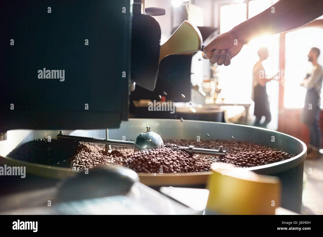 Coffee roaster roasting coffee beans Stock Photo Alamy