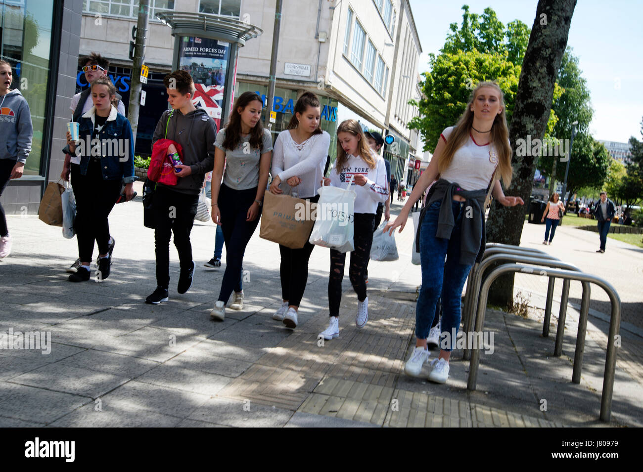 Plymouth, Devon. Royal Parade. A group of young people with shopping bags Stock Photo