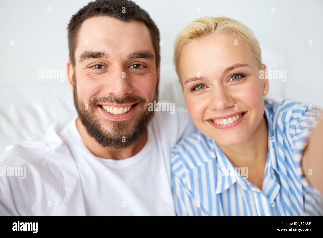 happy couple taking selfie at home Stock Photo - Alamy