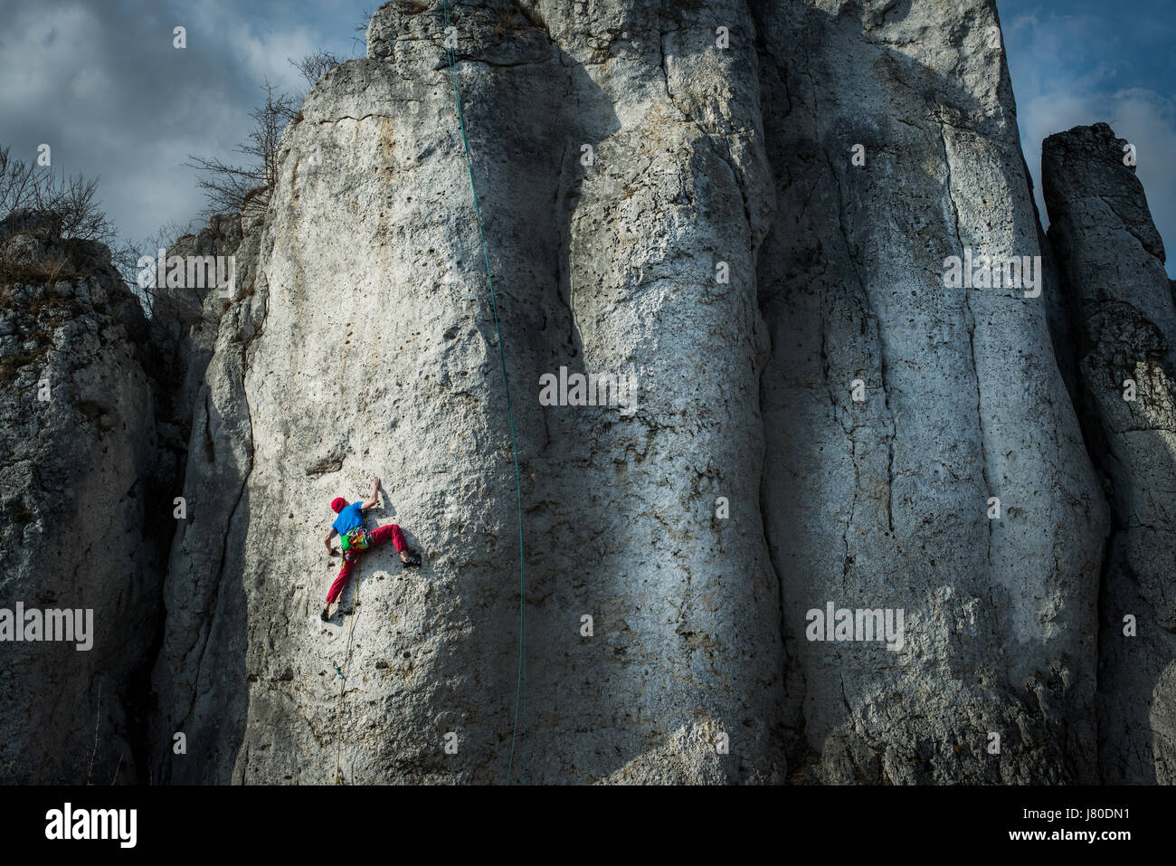 Man is climbing vertical wall, Jura, Poland Stock Photo