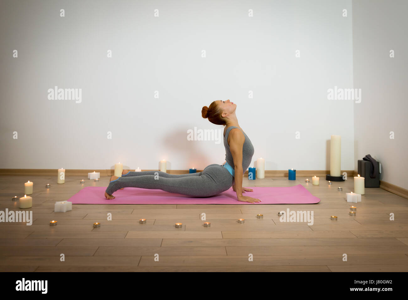 Yoga among candles Stock Photo Alamy