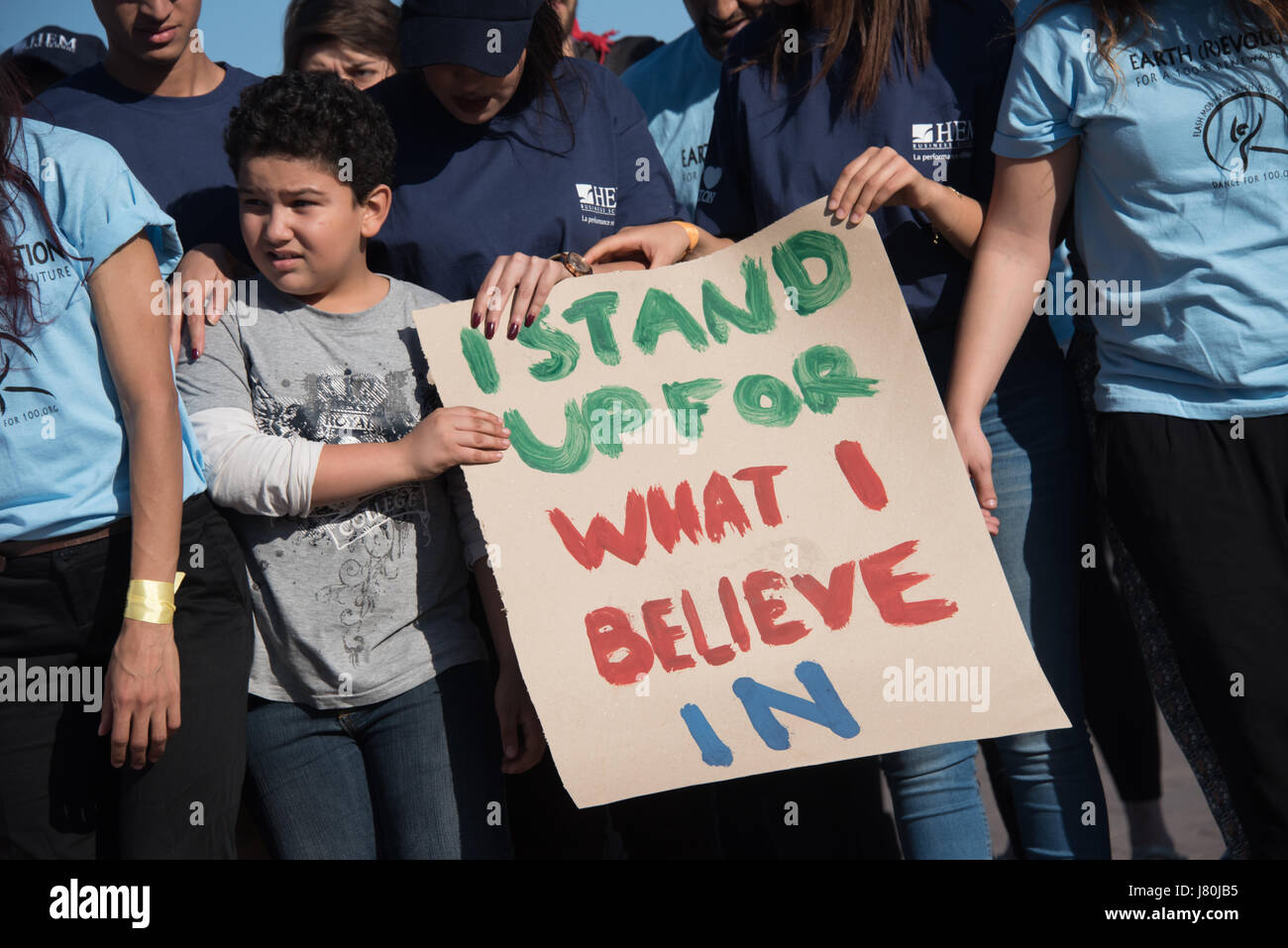 Young activists at the COP22 UN climate conference hold a sign reading 'I Stand Up For What I Believe In' at a demonstration in Jemaa el-Fnaa, the central market plaza in Marrakech, Morocco, November 10, 2016. Stock Photo