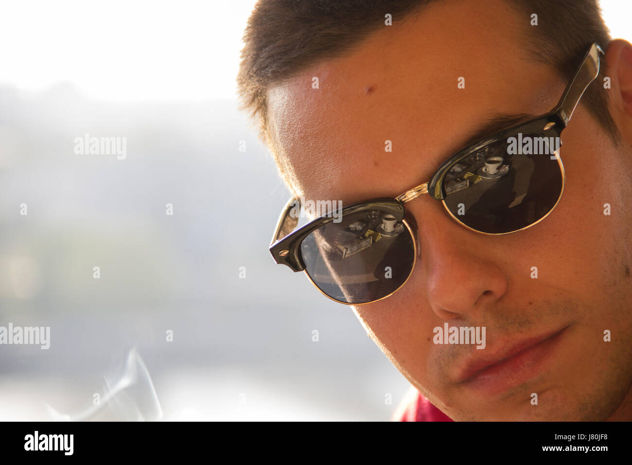 Portrait Of A Young Man With Sunglasses Stock Photo - Alamy
