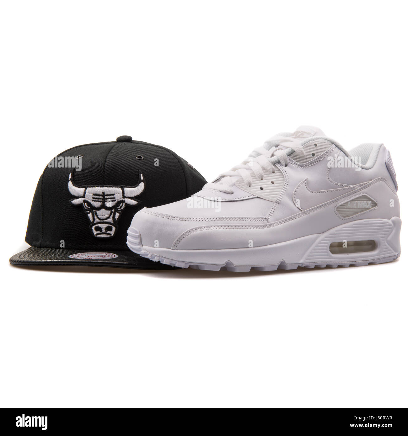 White Nike Air Max Sneaker and Black Mitchell & Ness Chicago Bulls Cap  Stock Photo - Alamy