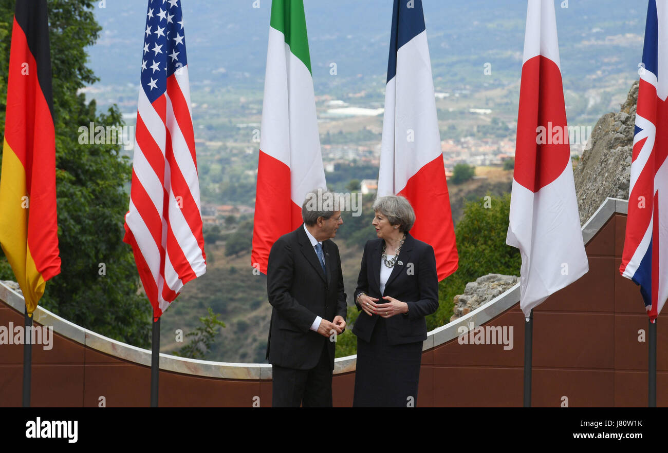 Italian Prime Minister Paolo Gentiloni and Prime Minister Theresa May pose for photos at the G7 summit at Teatro Greco in Taormina, Sicily, Italy. Stock Photo