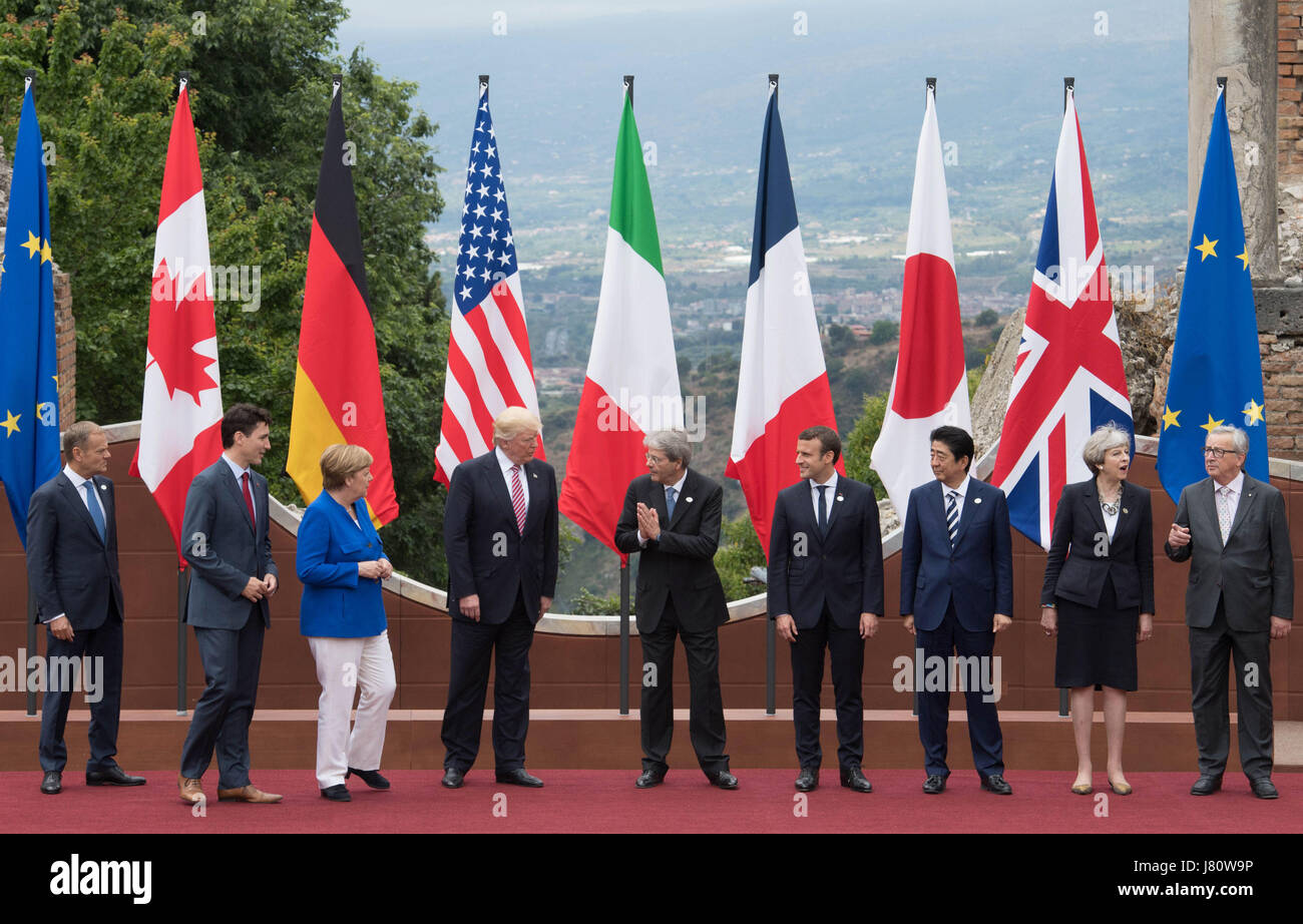 (From the left) President of the European Council Donald Tusk, Candian Prime Minister Justin Trudeau, German Chancellor Angela Merkel, US President Donald Trump, Italian Prime Minister Paolo Gentiloni, French President Emmanuel Macron, Japanese Prime Minister Shinzo Abe, Prime Minister Theresa May and President of the European Commission Jean-Claude Juncker pose for the family photo at the G7 summit at Teatro Greco in Taormina, Sicily, Italy. Stock Photo