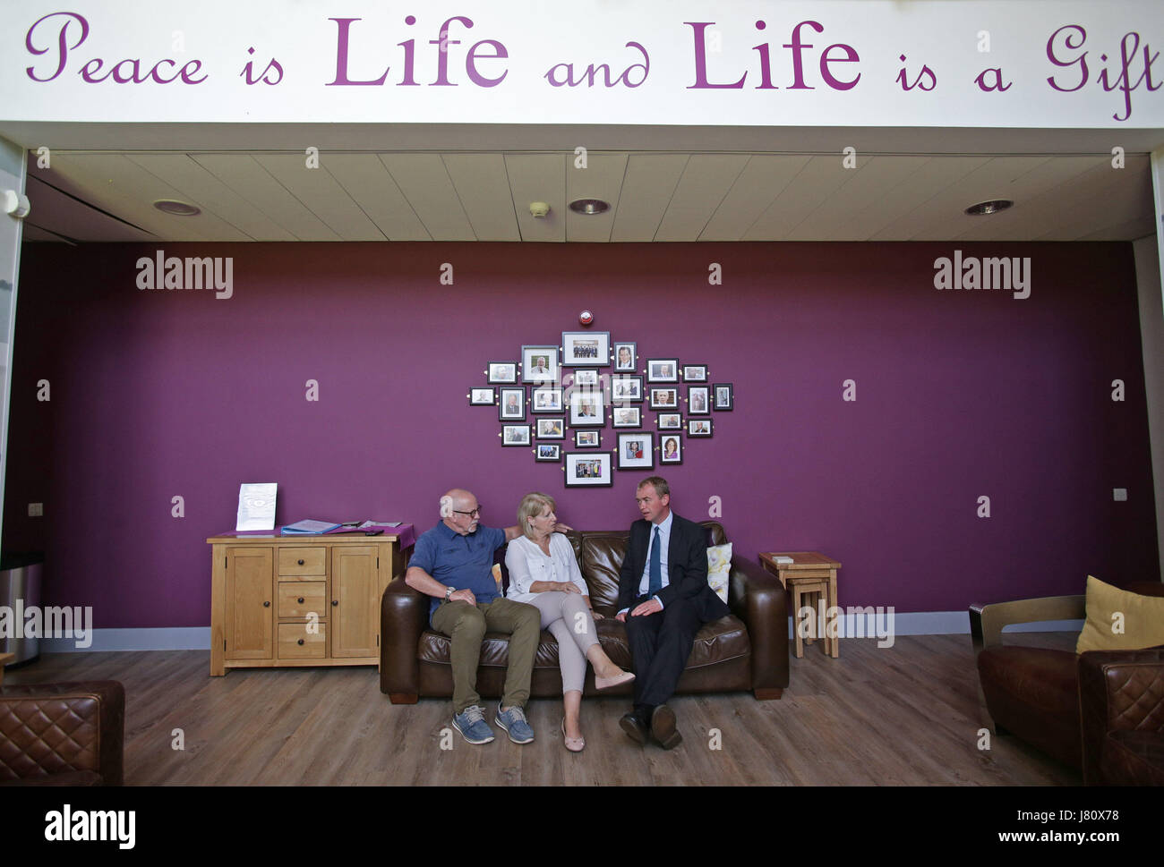 Liberal Democrat leader Tim Farron (right) with Colin and Wendy Parry during a visit to the Tim Parry &amp; Johnathan Ball Foundation for Peace, during a General Election campaign event in Warrington. Stock Photo