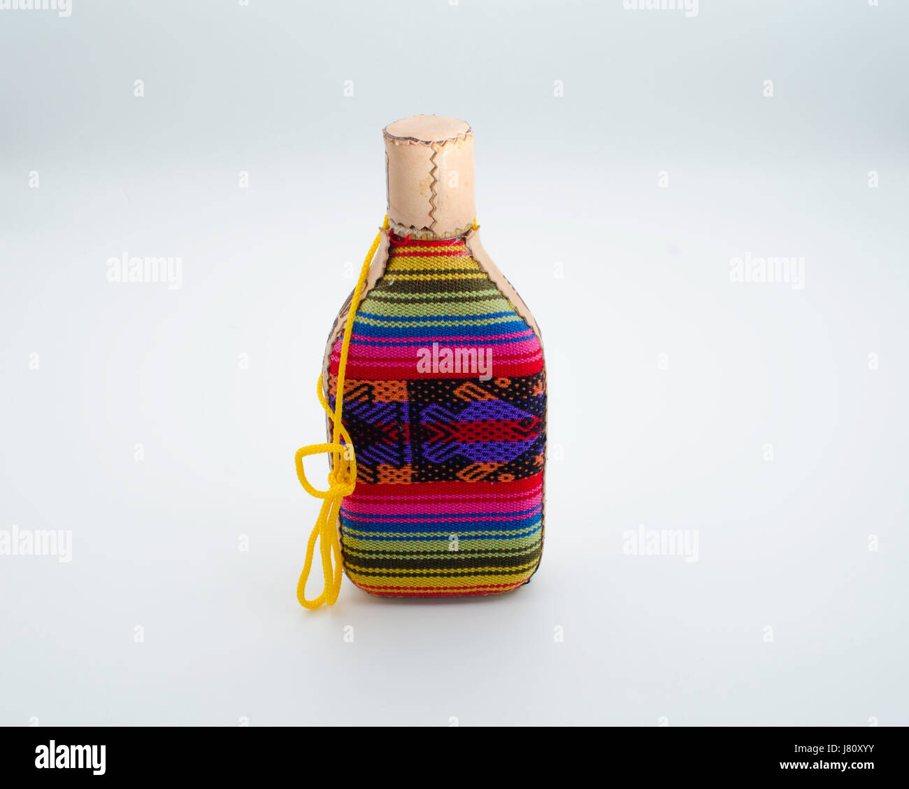 Bottle wrapped with colorful wool fabric Stock Photo
