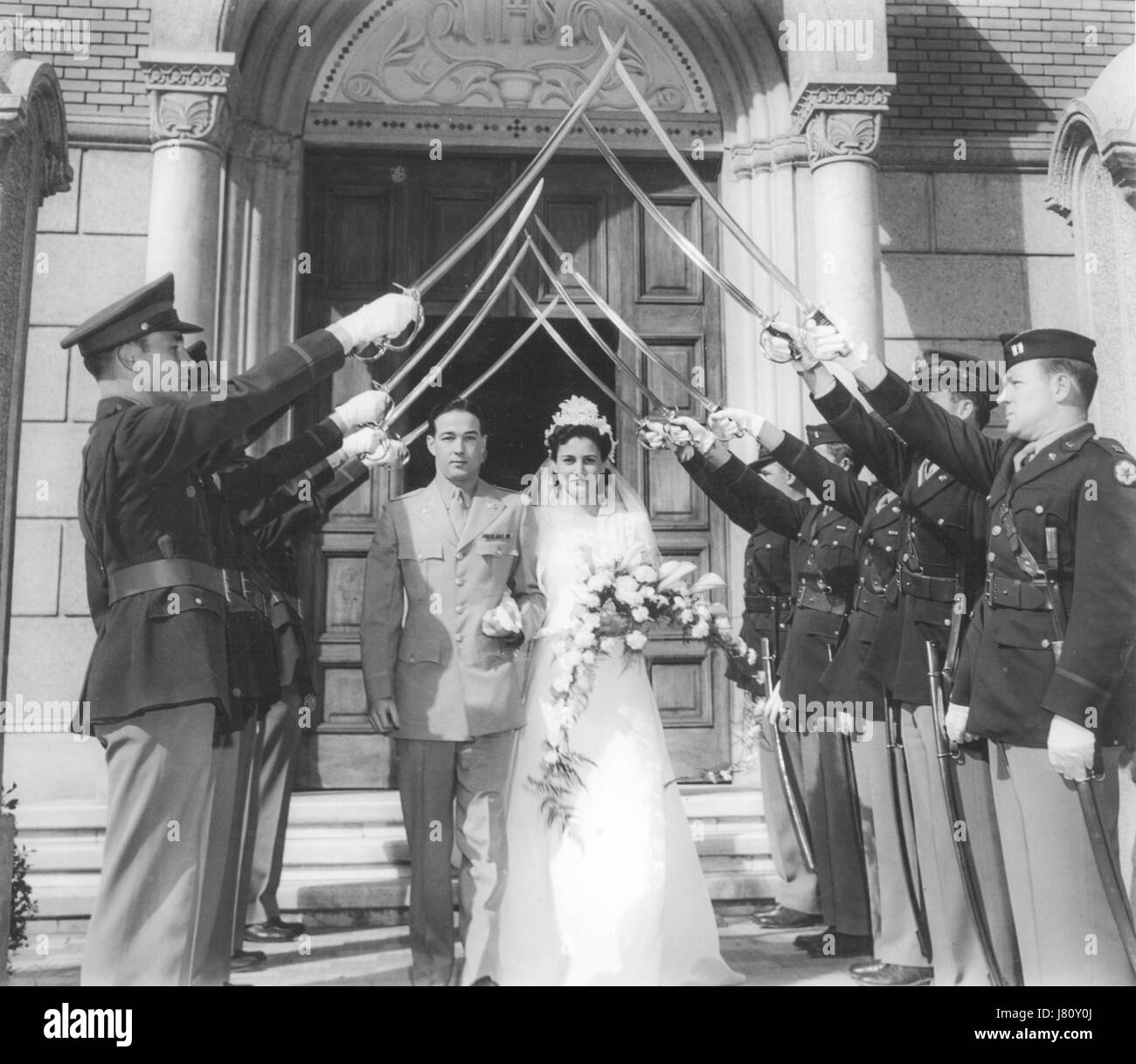 Military Saber Arch Honoring Bride and Groom, 1940's USA Stock Photo