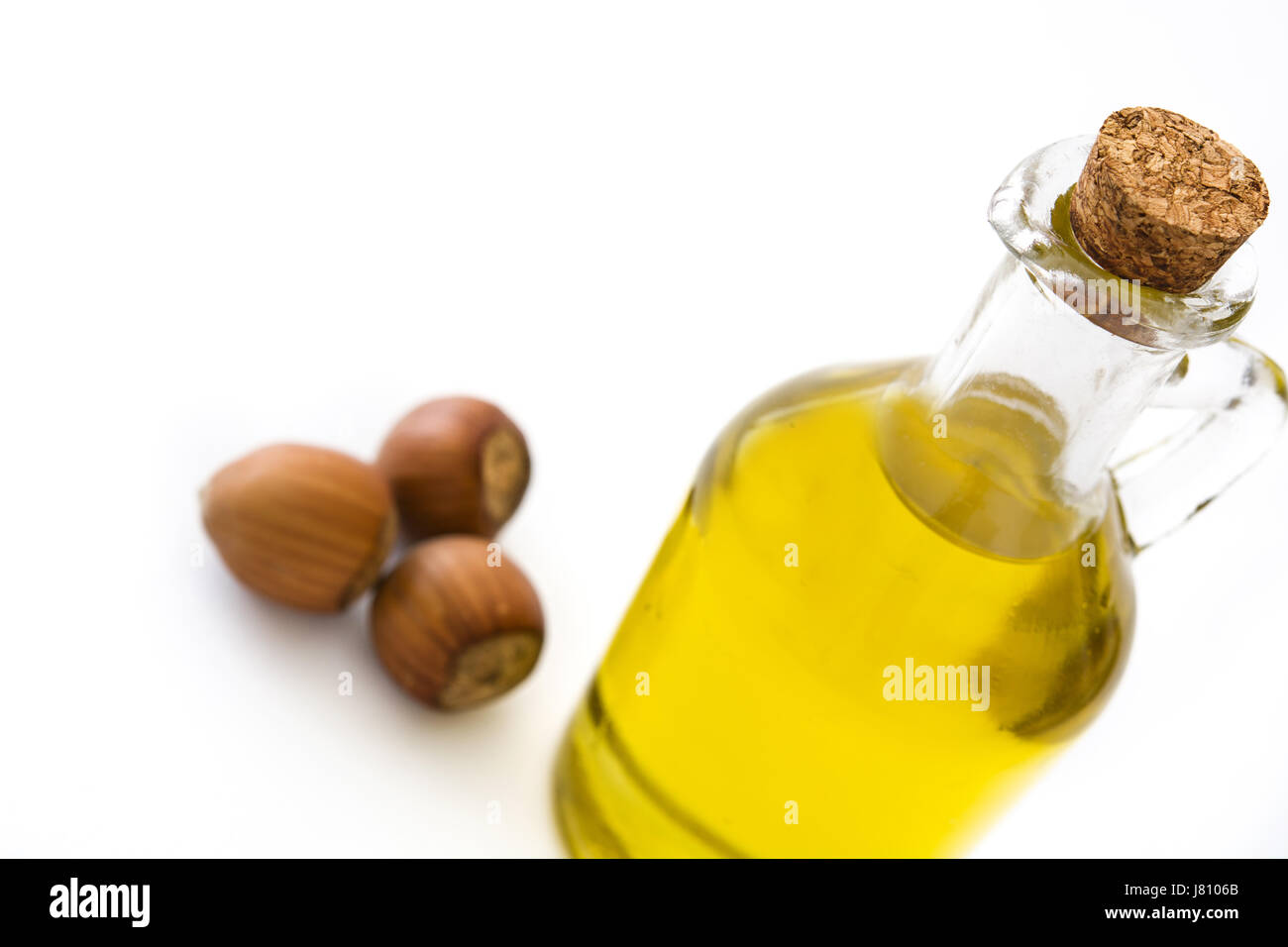 Hazelnuts oil isolated on white background Stock Photo Alamy