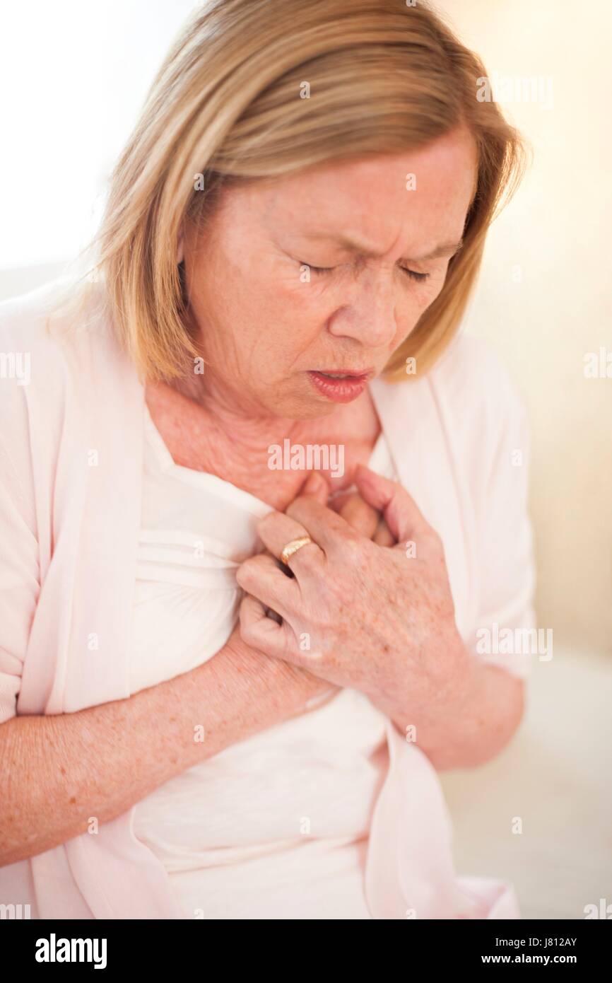 Woman with chest pain. Stock Photo