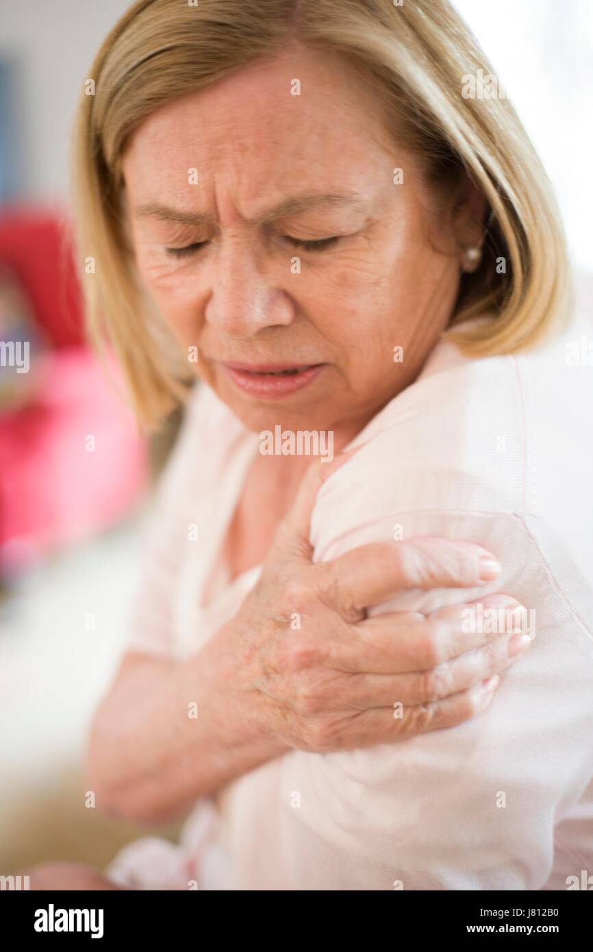 Woman with shoulder pain. Stock Photo