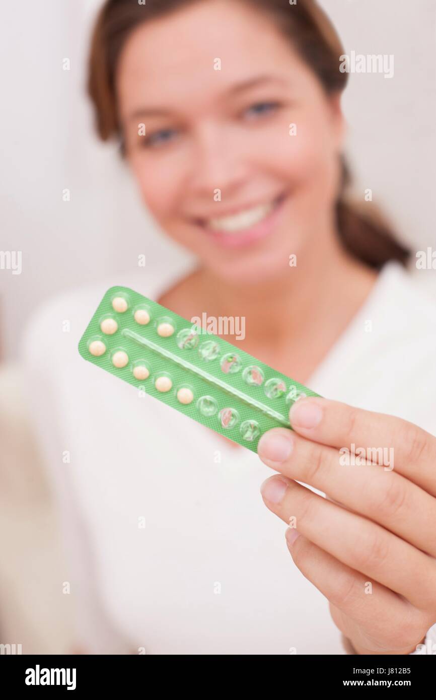 Woman holding blister pack with contraceptive pills. Stock Photo
