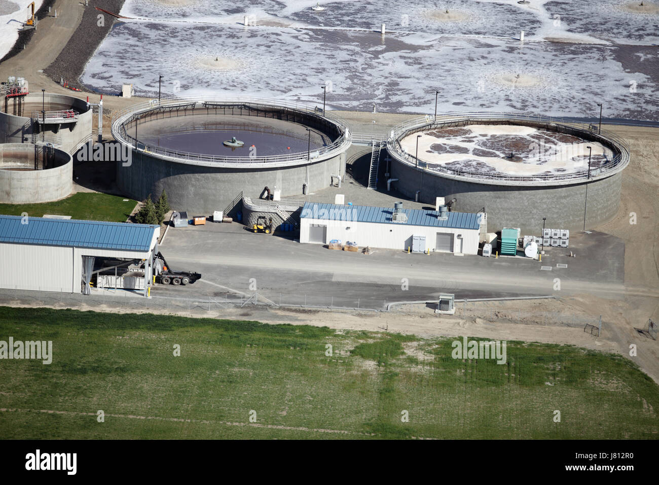 An aerial view of the sewage treatment plant with aeration ponds, and settling tanks. Stock Photo