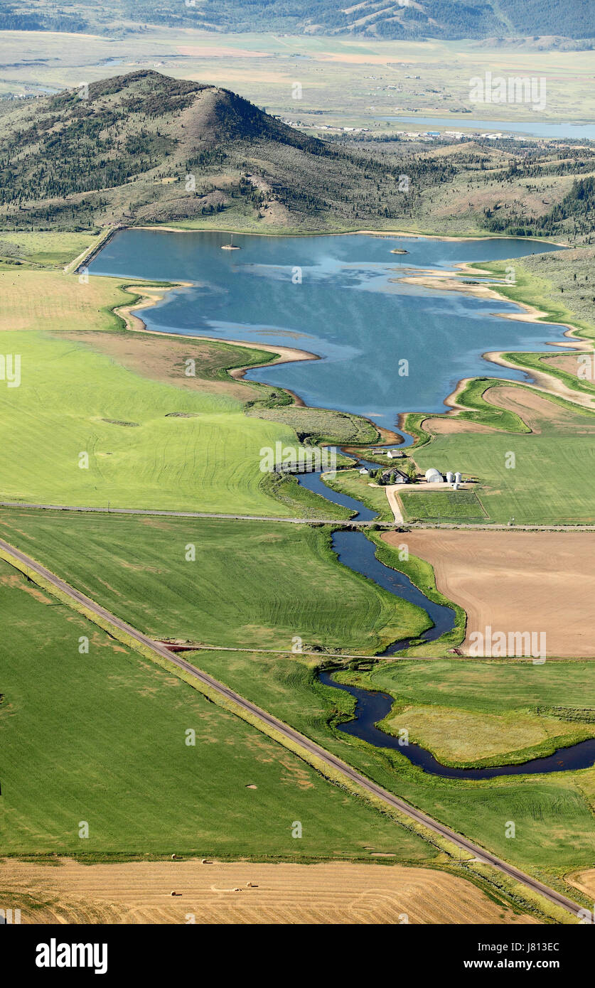 A smalll reservoir for storing irrigation water for farming. Stock Photo