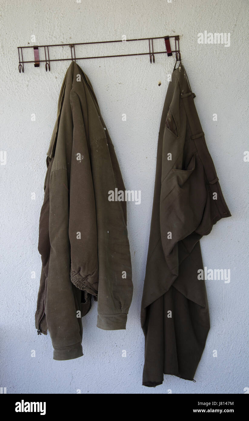 Old, shattered, dusty and filthy clothes. Worn out while working on the ...