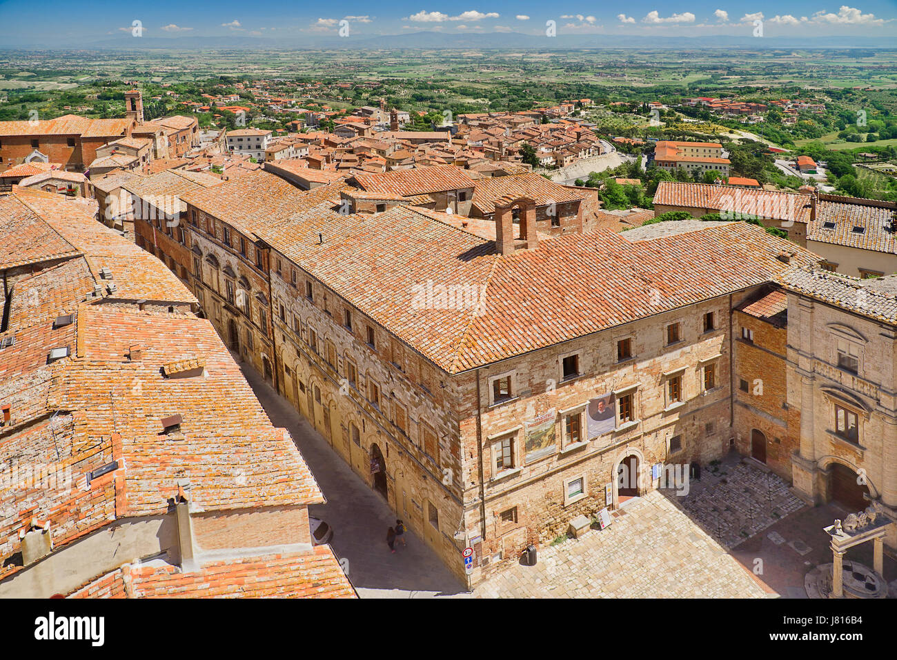 Italy, Tuscany, Montepulciano, View over the rooftops of the town towards distant hills from the tower of Palazzo Comunale or Town Hall. Stock Photo