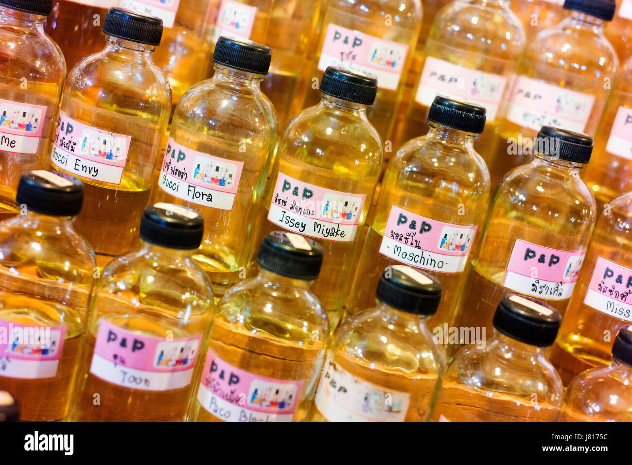 Bottles of essential oil for sale at a night market near Chiang Rai. Stock Photo