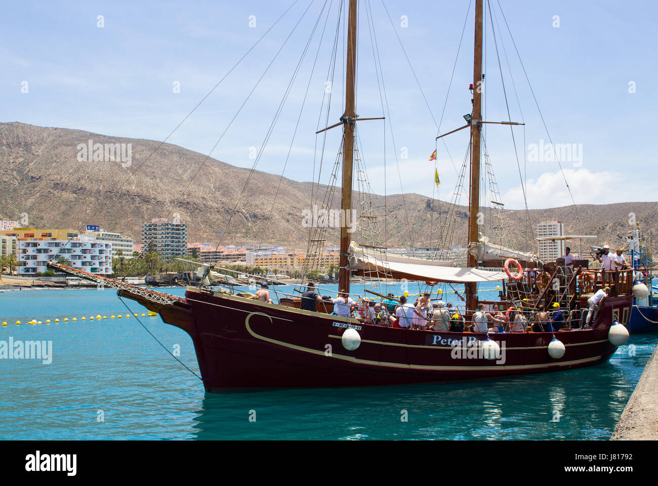 The retro galleon Peter Pan used for tourists fun tours in Teneriffe leaves the quayside at Los Cristianos with crew and passengers on board Stock Photo