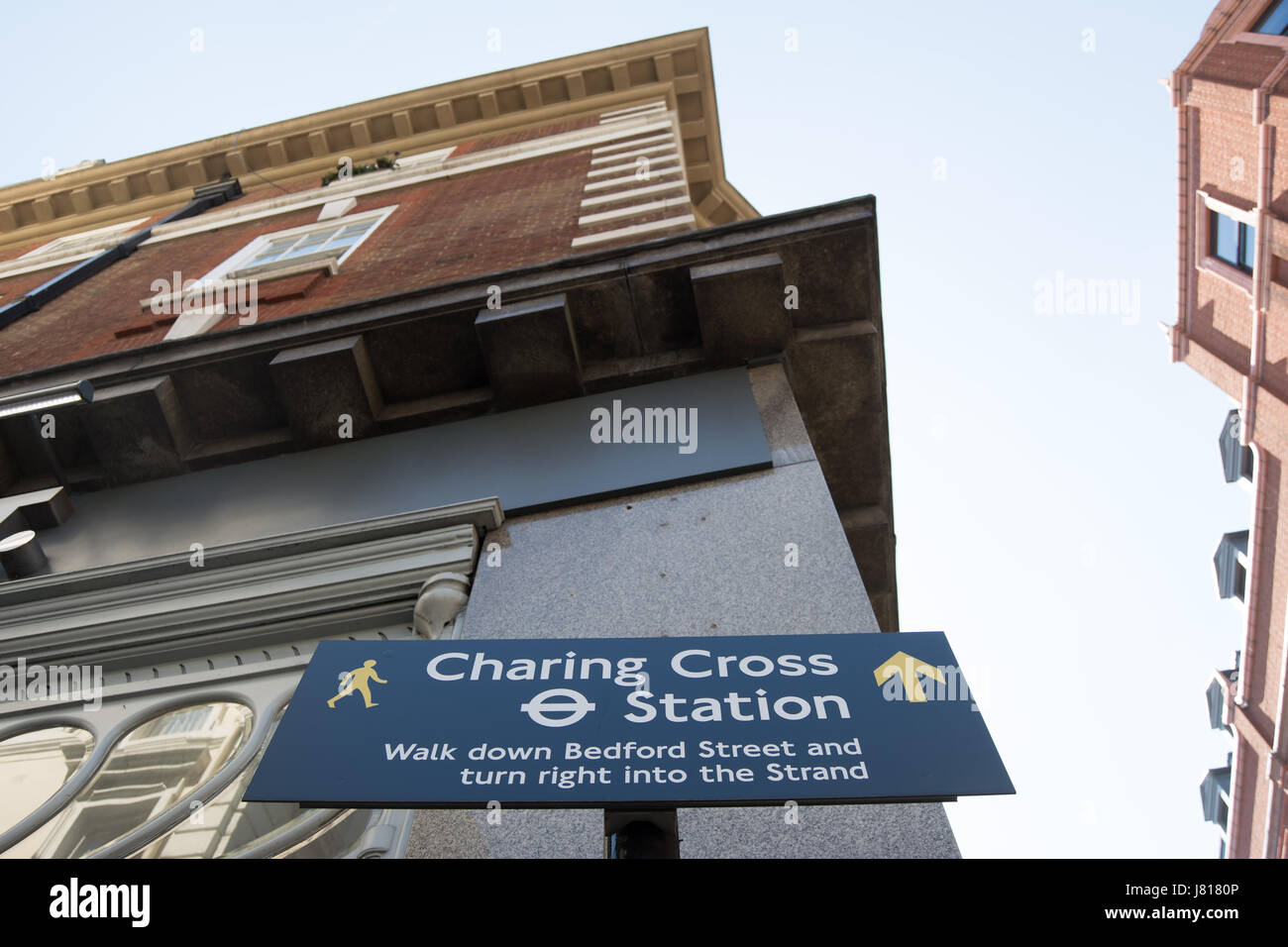 wayfinding sign giving directions to charing cross station, in covent