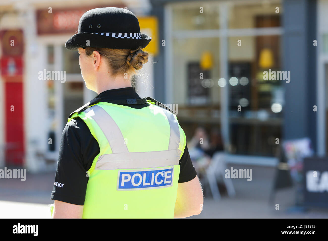 WPC woman police officer seen from behind UK Britain Stock Photo - Alamy