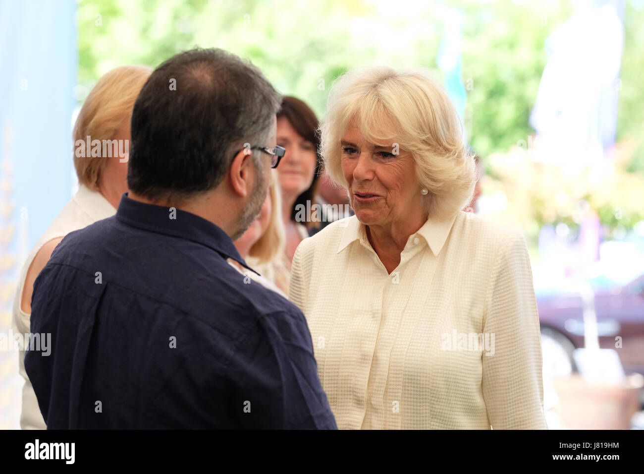 Hay Festival 2017 - Hay on Wye, Wales, UK - Friday 26th May 2017 - HRH Camilla Duchess of Cornwall arrives at the Hay Festival and is seen with Peter Florence Director of the Hay Festival ( on left ) - the Hay Festival celebrates its 30th anniversary in 2017. Over 4,000 secondary school children will attend the second day of the literary festival that runs until June 4th.  Steven May / Alamy Live News Stock Photo