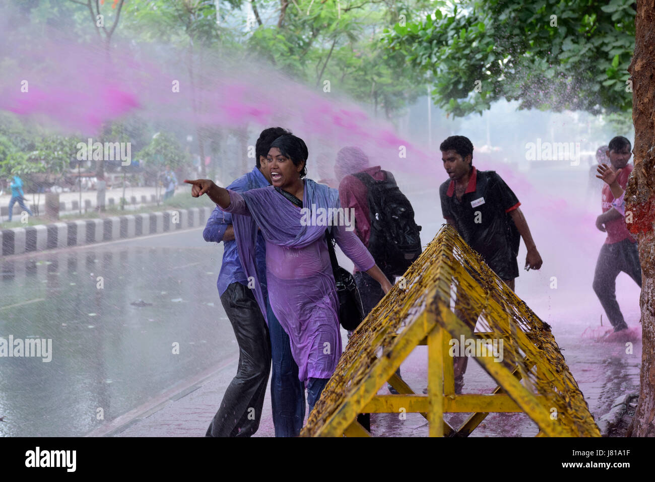 Dhaka, Bangladesh. 26th May, 2017.  Police have lobbed teargas shells and water canon to disband people protesting the removal of Lady Justice's statue from the Supreme Court premises, in Dhaka, Bangladesh, May 26, 2017. The statue was removed from its spot near the court's entrance on Thursday night, following demands by radical Islamist outfit Hifazat-e-Islam. Enraged by the decision, leftist student bodies began demonstrating outside the court premise and announced protests for the morning. Credit: SK Hasan Ali/Alamy Live News Stock Photo