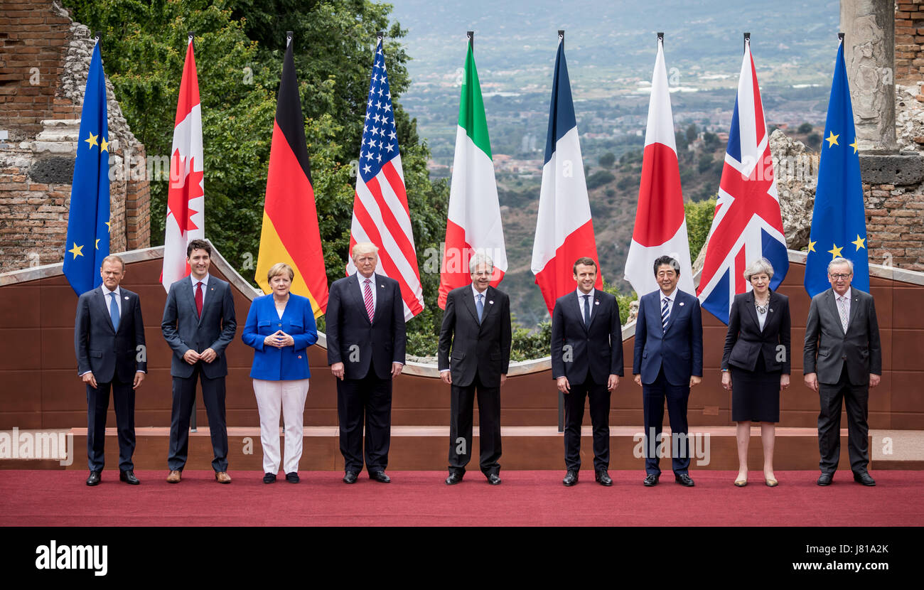 President of the European Council Donald Tusk (L-R) poses next to Canada's Prime Minister Justin Trudeau, Germany's Chancellor Angela Merken, US President Donald Trump, Italy's Minister President Paolo Gentiloni, President of France Emmanuel Macron, Japan's Shinzo Abe, Britain's Theresa May and President of the European Commission Jean-Claude Juncker for the 'family portrait' in front of the Ancient Greek theatre at the G7 summit in Taormina in Sicily, Italy, 26 May 2017. The heads of the G7 states meet in Sicily from 26 May until 27 May 2017. Stock Photo